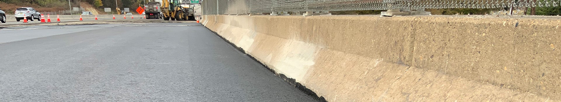 Highway divider concrete asphalt close perspective rosphalt