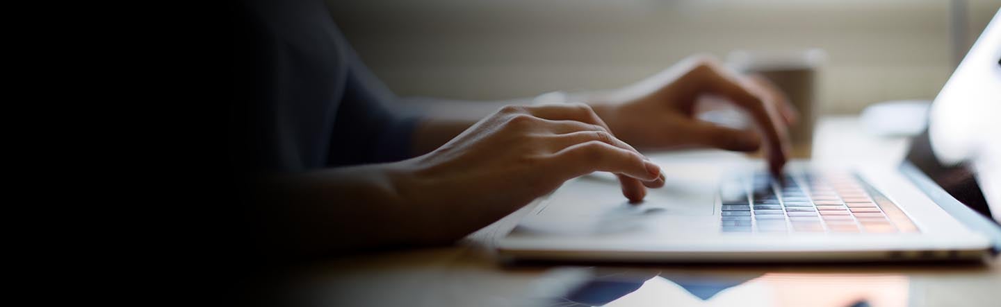 image of hand with fingers on a keyboard